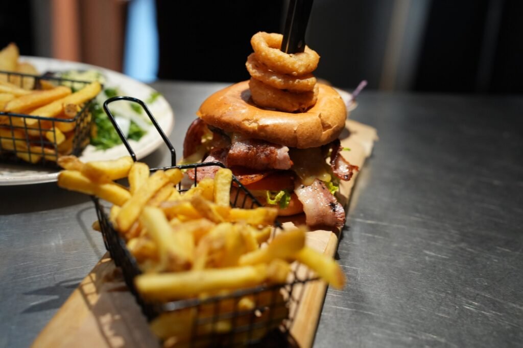 Burger with onion rings and chips